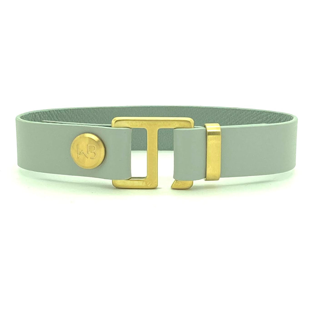 Our striking smoke grey leather cuff bracelet is paired perfectly with our artisan designed hardware. Choice includes rose gold, yellow gold, stainless steel or black ceramic. This adjustable size bracelet is a distinctive piece worn alone or with a WristBend stacking bracelet.  Made by WristBend