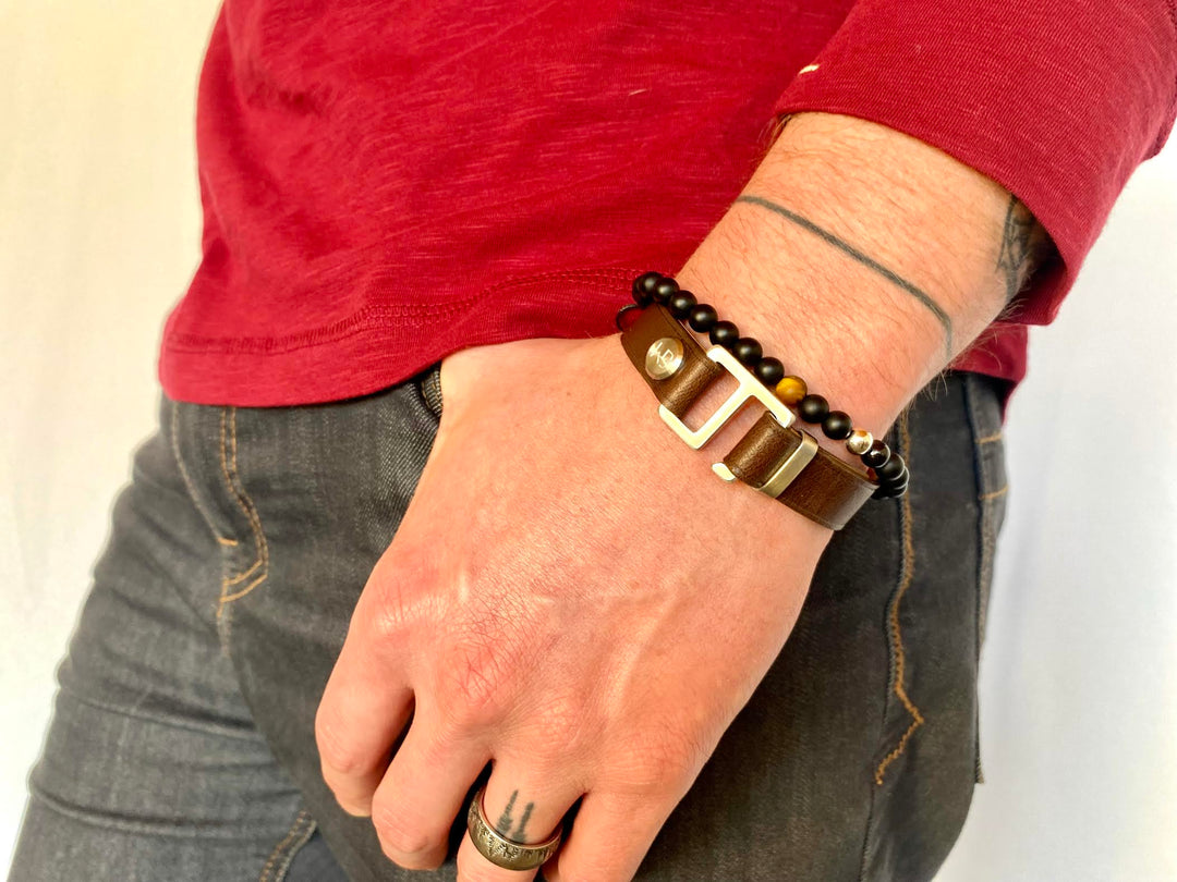 Our striking dark brown Italian leather cuff bracelet is paired perfectly with our artisan designed  hardware. Choice includes brushed rose gold, yellow gold, stainless steel or black ceramic. This adjustable size bracelet is a distinctive piece worn alone or with a WristBend stacking bracelet. Made by WristBend