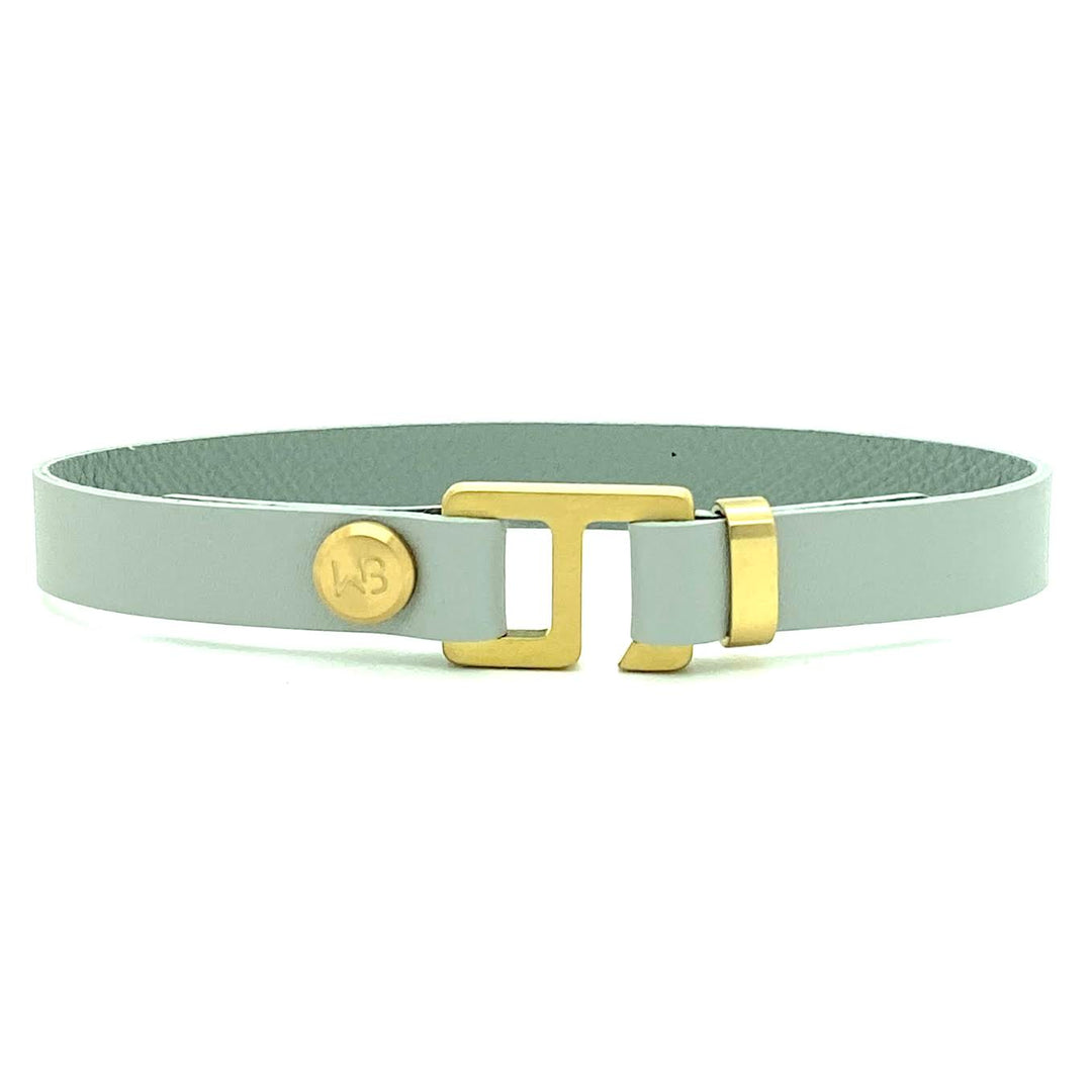 With a trendy, cool modern vibe, this French charcoal/smoke grey leather cuff bracelet is paired with your choice of brushed stainless steel, brass or black ceramic hardware. Our signature cuff bracelet is a modern staple for your WristBend collection. Made by WristBend