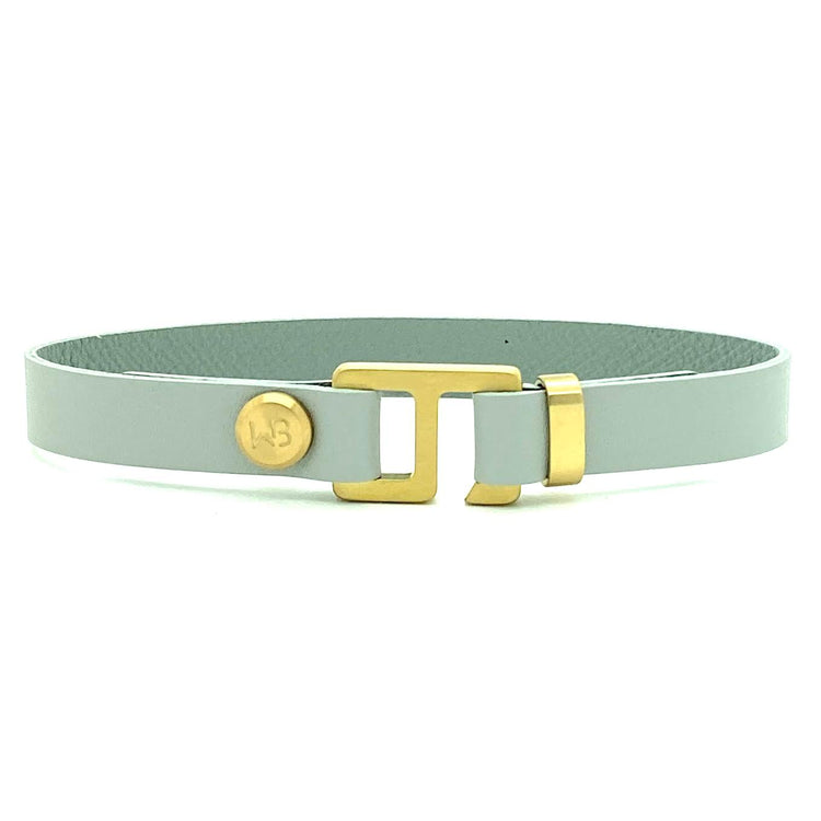 With a trendy, cool modern vibe, this French charcoal/smoke grey leather cuff bracelet is paired with your choice of brushed stainless steel, brass or black ceramic hardware. Our signature cuff bracelet is a modern staple for your WristBend collection. Made by WristBend