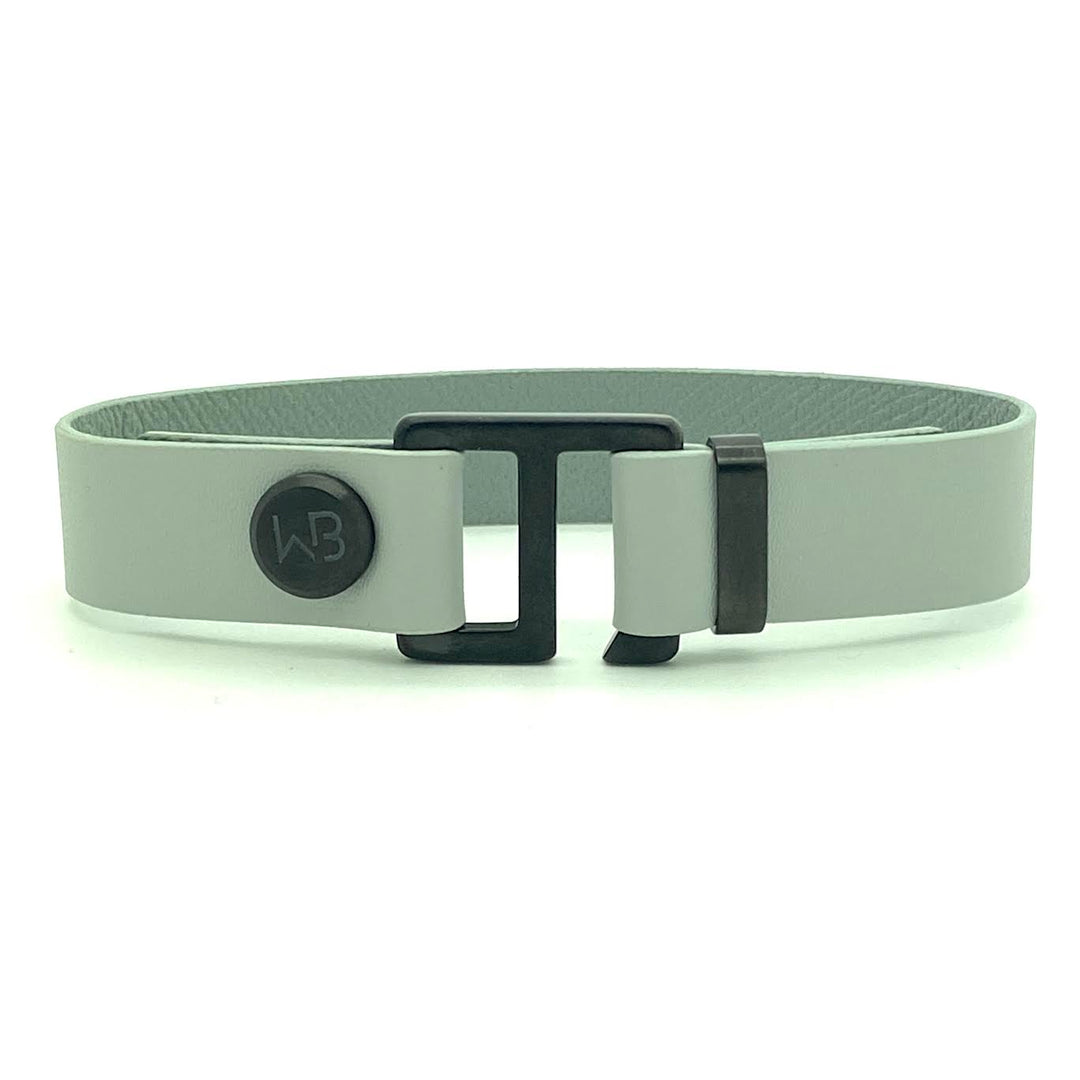 Our striking smoke grey leather cuff bracelet is paired perfectly with our artisan designed hardware. Choice includes rose gold, yellow gold, stainless steel or black ceramic. This adjustable size bracelet is a distinctive piece worn alone or with a WristBend stacking bracelet. Made by WristBend