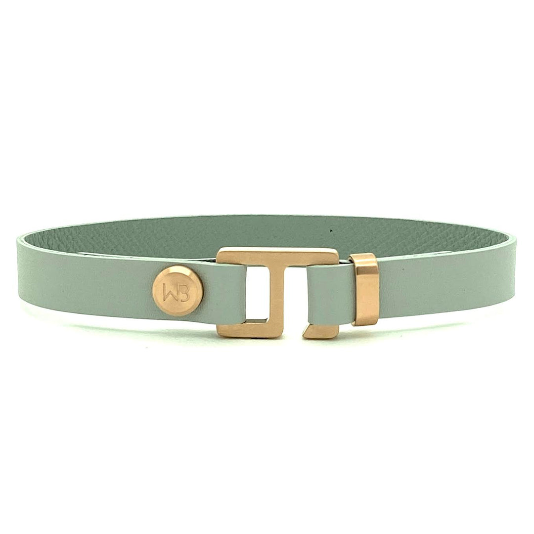 With a trendy, cool modern vibe, this French charcoal/smoke grey leather cuff bracelet is paired with your choice of brushed stainless steel, brass or black ceramic hardware. Our signature cuff bracelet is a modern staple for your WristBend collection. Made by WristBend