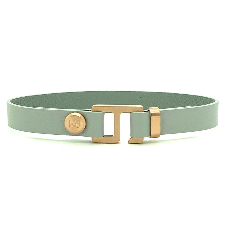 With a trendy, cool modern vibe, this French charcoal/smoke grey leather cuff bracelet is paired with your choice of brushed stainless steel, brass or black ceramic hardware. Our signature cuff bracelet is a modern staple for your WristBend collection. Made by WristBend