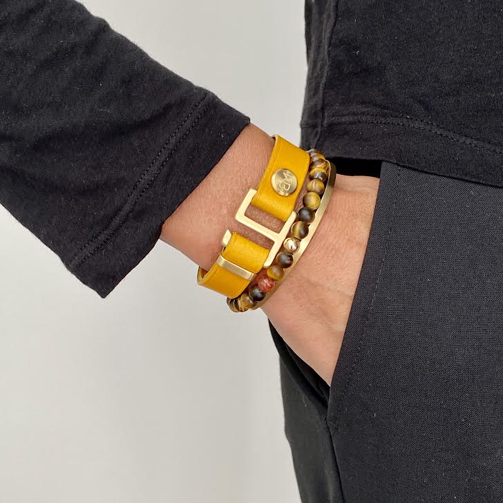 Stack your wrist with leather, bead and metal cuff bracelets. Made by WristBend