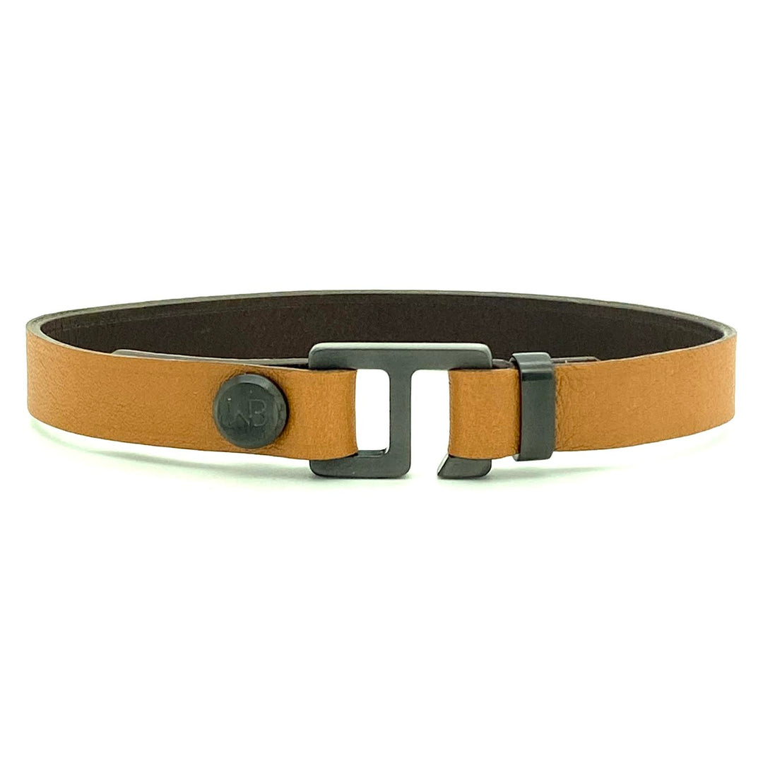 With a trendy, cool modern vibe, this tan/dark brown Italian leather cuff bracelet is paired with your choice of brushed stainless steel, brass or black ceramic hardware. Our signature cuff bracelet is a modern staple for your WristBend collection. Made by WristBend