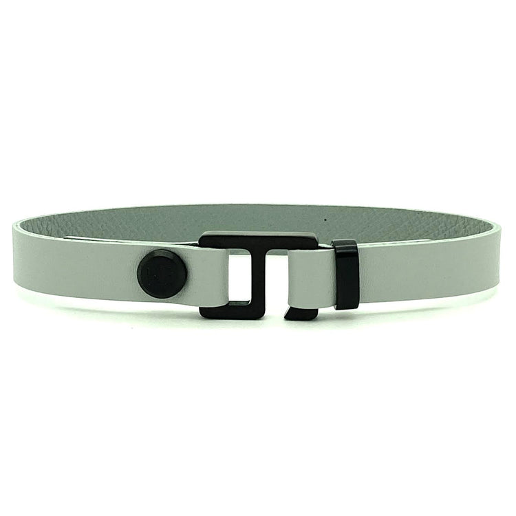 With a trendy, cool modern vibe, this French charcoal/smoke grey leather cuff bracelet is paired with your choice of brushed stainless steel, brass or black ceramic hardware. Our signature cuff bracelet is a modern staple for your WristBend collection. Made by WristBend