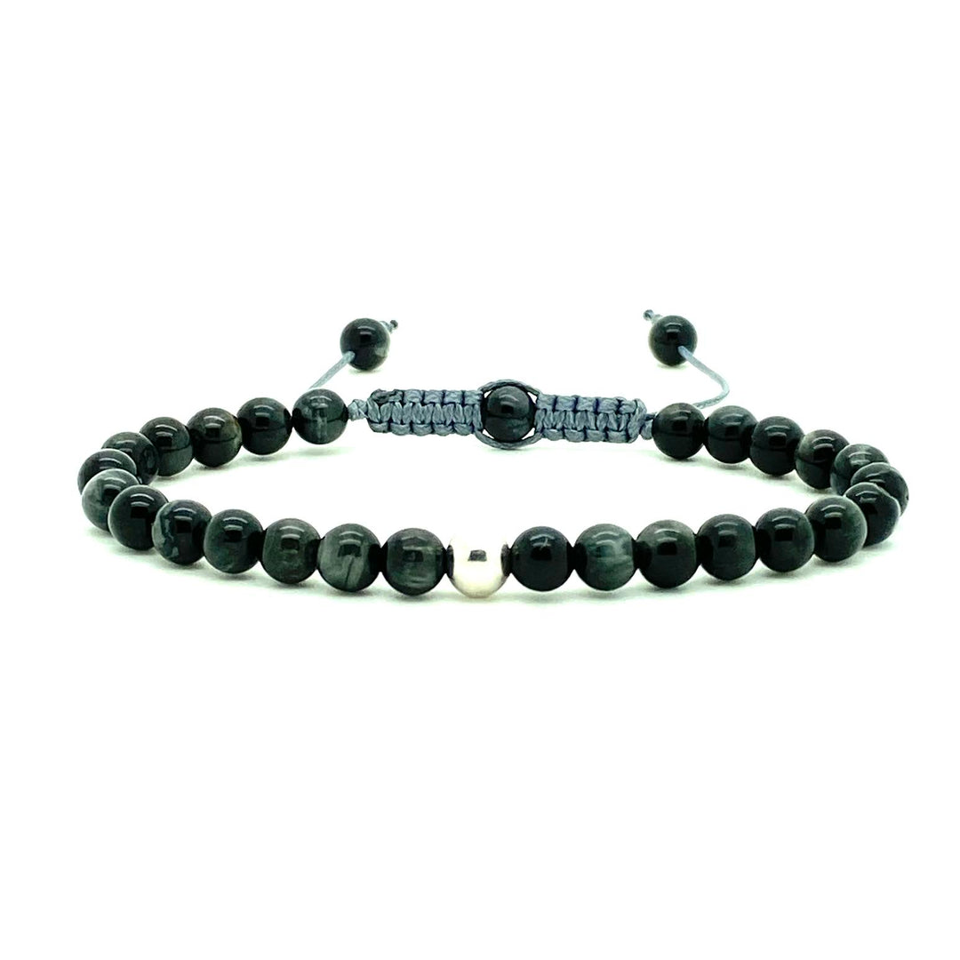 Cat's Eye beads act to stimulate intuition and to enhance protective energy. These smooth Cat's Eye beads are accented with your choice of solid 14K white, rose and yellow gold beads. Hand knotted adjustable cord for a perfect fit. Made by WristBend