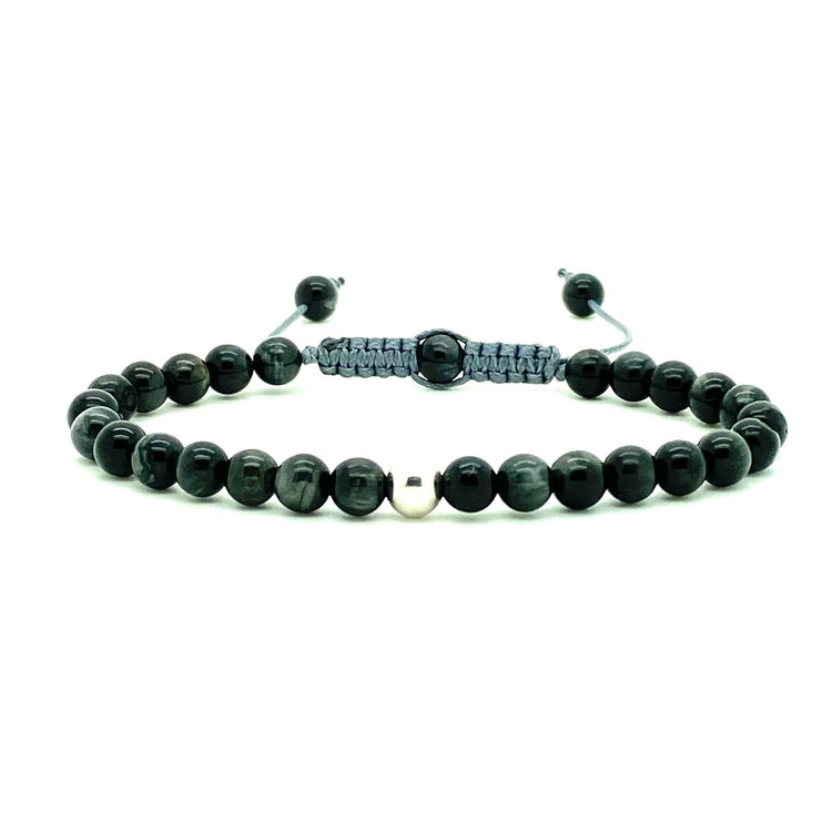 Cat's Eye beads act to stimulate intuition and to enhance protective energy. These smooth Cat's Eye beads are accented with your choice of solid 14K white, rose and yellow gold beads. Hand knotted adjustable cord for a perfect fit. Made by WristBend