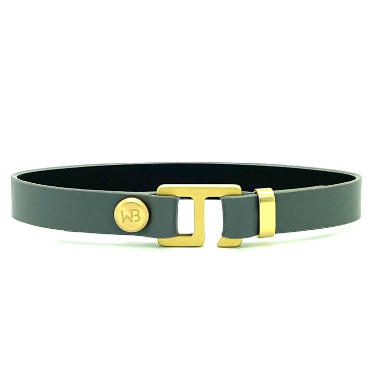With a trendy, cool modern vibe, this charcoal grey/navy blue leather cuff bracelet is paired with your choice of brushed stainless steel, brass or black ceramic hardware. Our signature cuff bracelet is a modern staple for your WristBend collection. Made by WristBend
