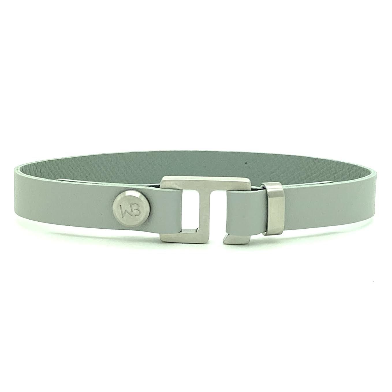 With a trendy, cool modern vibe, this French charcoal/smoke grey leather cuff bracelet is paired with your choice of brushed stainless steel, brass or black ceramic hardware. Our signature cuff bracelet is a modern staple for your WristBend collection. Made by WristBend