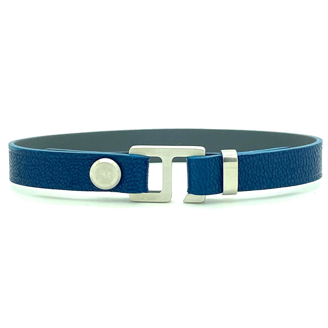 With a trendy, cool modern vibe, this sapphire blue French leather cuff bracelet is paired with your choice of brushed rose gold, yellow gold, stainless steel, or black ceramic hardware. Our signature cuff bracelet is a modern staple for your WristBend collection. Made by WristBend