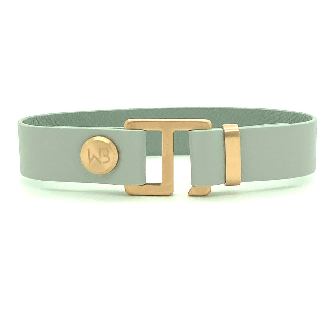 Our striking smoke grey leather cuff bracelet is paired perfectly with our artisan designed hardware. Choice includes rose gold, yellow gold, stainless steel or black ceramic. This adjustable size bracelet is a distinctive piece worn alone or with a WristBend stacking bracelet.  Made by WristBend