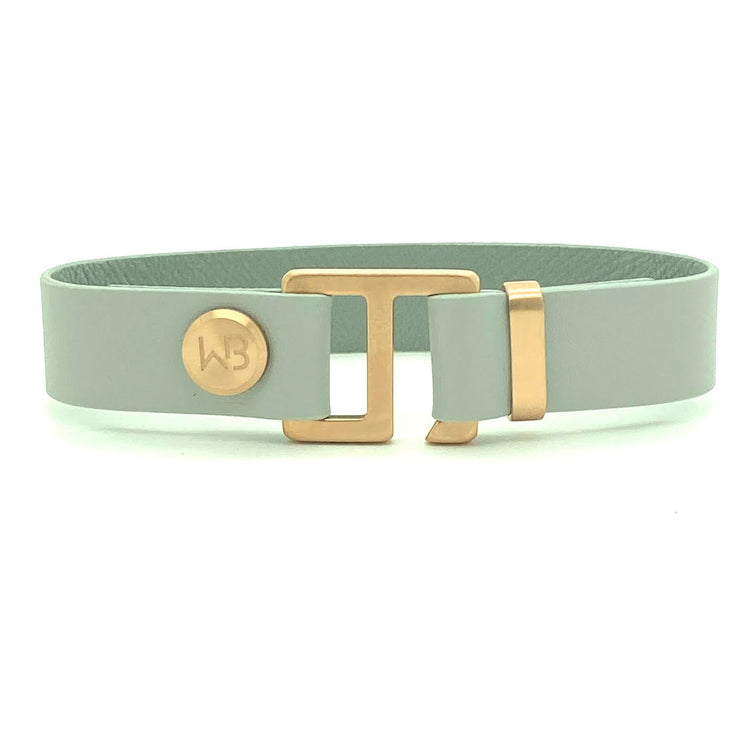 Our striking smoke grey leather cuff bracelet is paired perfectly with our artisan designed hardware. Choice includes rose gold, yellow gold, stainless steel or black ceramic. This adjustable size bracelet is a distinctive piece worn alone or with a WristBend stacking bracelet.  Made by WristBend