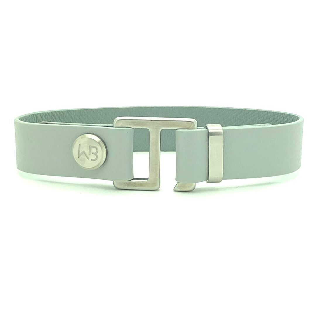 Our striking smoke grey leather cuff bracelet is paired perfectly with our artisan designed hardware. Choice includes rose gold, yellow gold, stainless steel or black ceramic. This adjustable size bracelet is a distinctive piece worn alone or with a WristBend stacking bracelet. Made by WristBend