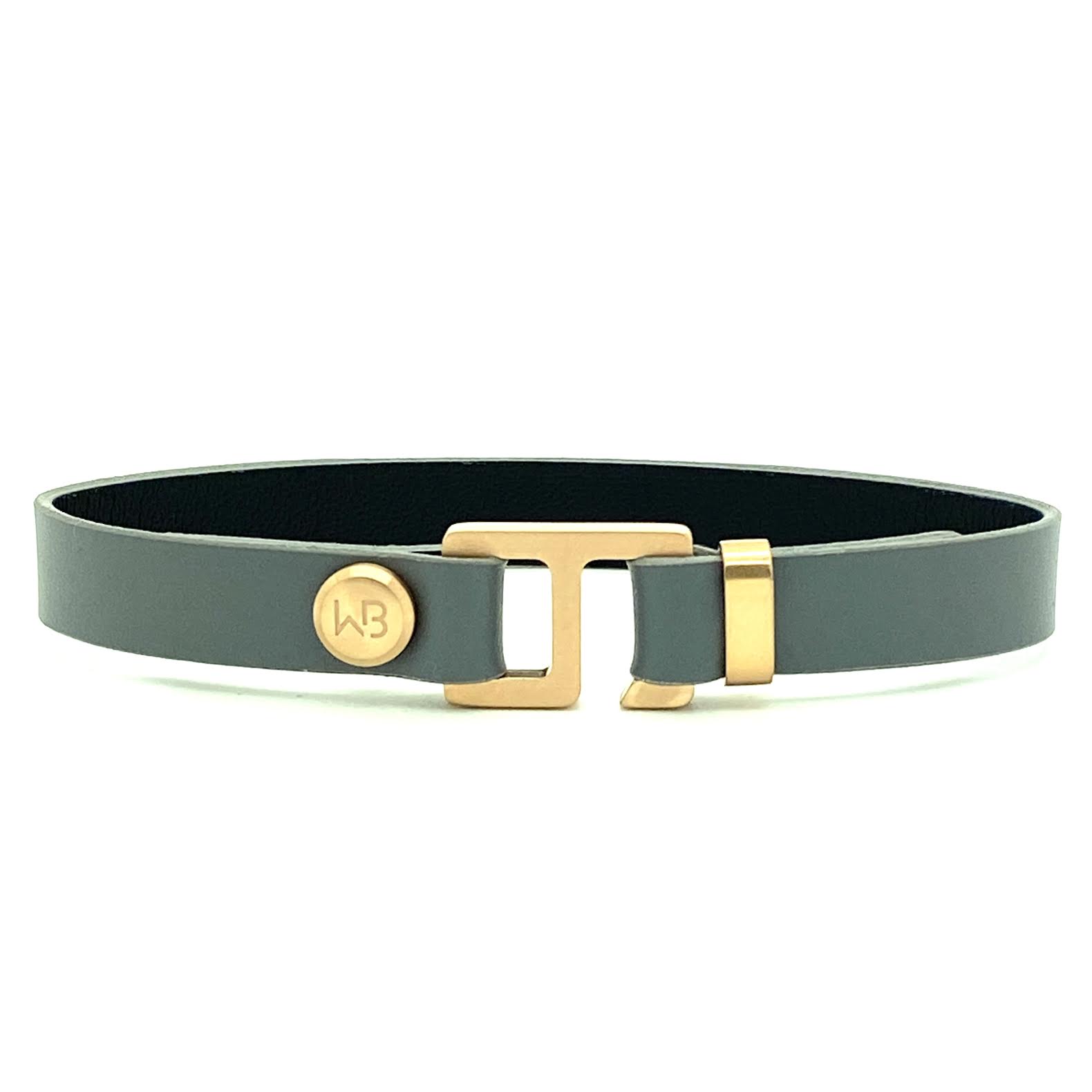 With a trendy, cool modern vibe, this charcoal grey/navy blue leather cuff bracelet is paired with your choice of brushed stainless steel, brass or black ceramic hardware. Our signature cuff bracelet is a modern staple for your WristBend collection. Made by WristBend