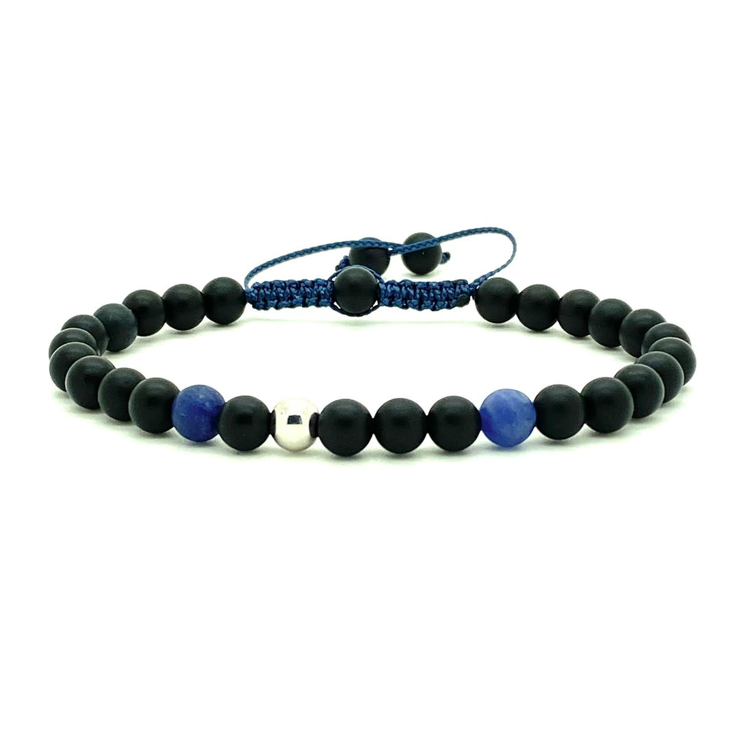 Trendy black matte onyx beads accented with two Sodalite beads, and your choice of a 14K solid white, rose or yellow gold bead. Hand knotted adjustable cord for a perfect fit. Made by WristBend