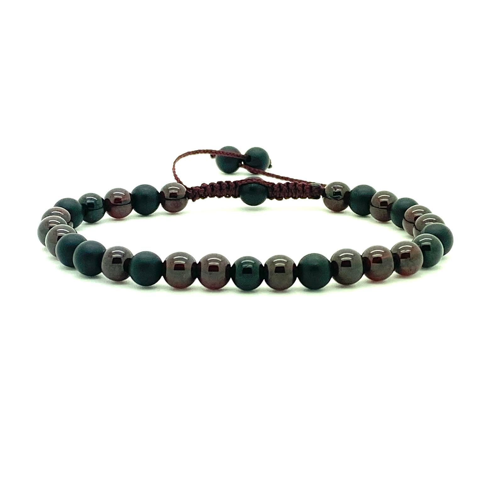 Trendy Red Garnet beads accented with black onyx beads. Hand knotted adjustable cord for a perfect fit. Made by WristBend