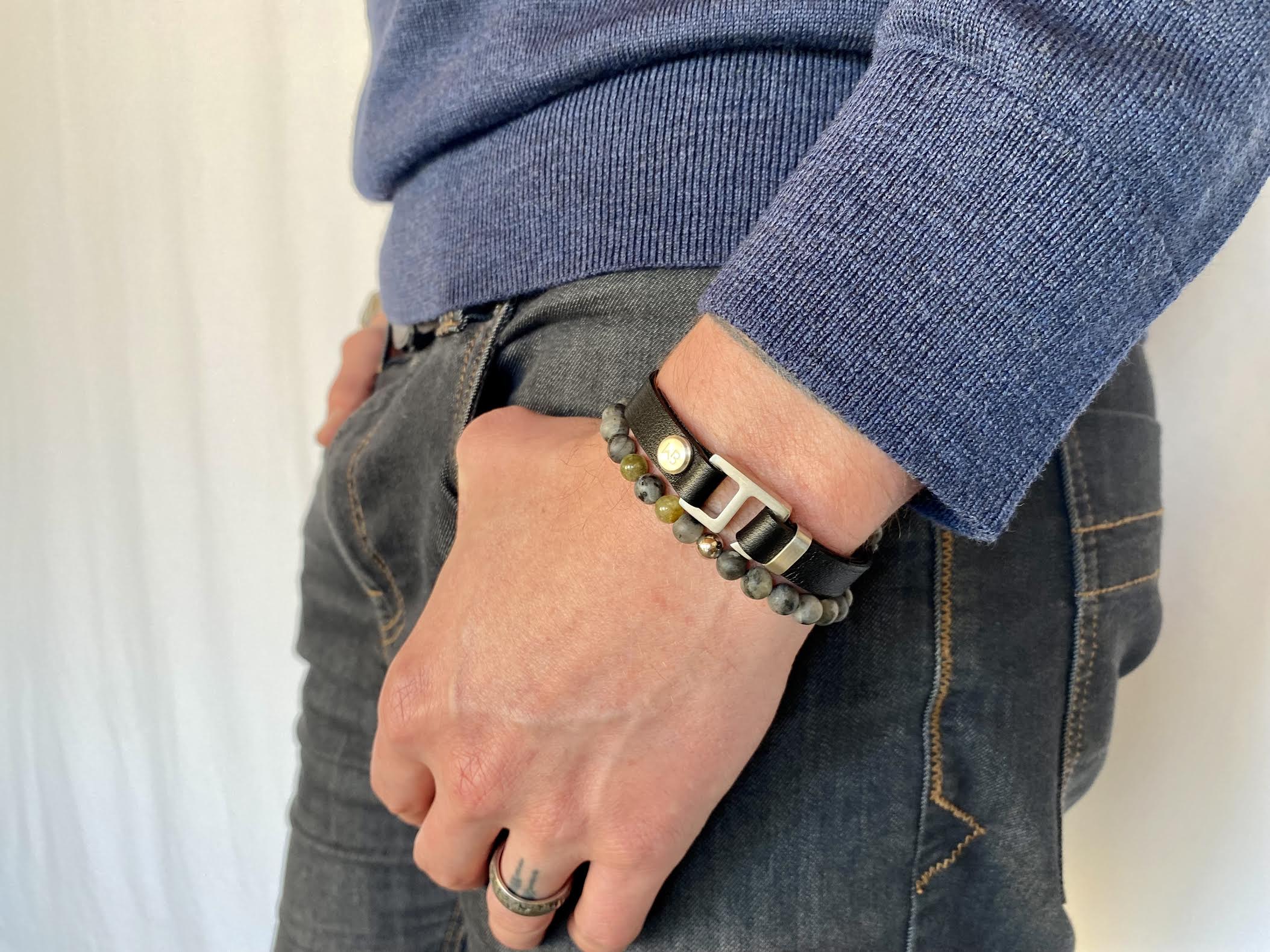With a trendy, cool modern vibe, this black Italian leather cuff bracelet is paired with your choice of brushed stainless steel, brass or black ceramic hardware. Our signature cuff bracelet is a modern staple for your WristBend collection. Made by WristBend