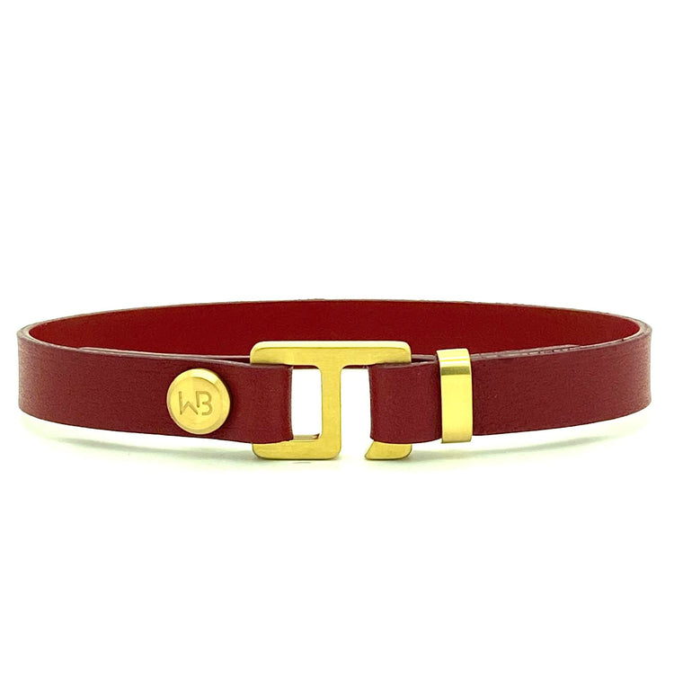 With a trendy, cool modern vibe, this burgundy/black Italian leather cuff bracelet is paired with your choice of brushed stainless steel, brass or black ceramic hardware. Our signature cuff bracelet is a modern staple for your WristBend collection. Made by WristBend