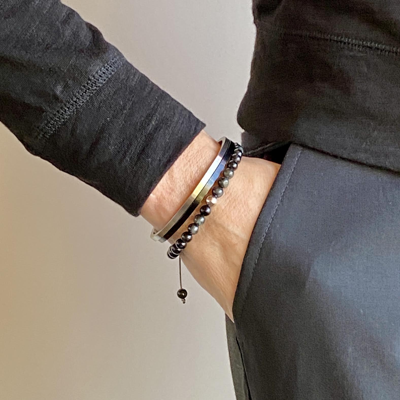 Cat's Eye beads act to stimulate intuition and to enhance protective energy. These smooth Cat's Eye beads are accented with your choice of 14K white, rose and yellow gold beads. Hand knotted adjustable cord for a perfect fit. Made by WristBend