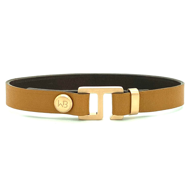 With a trendy, cool modern vibe, this tan/dark brown Italian leather cuff bracelet is paired with your choice of brushed stainless steel, brass or black ceramic hardware. Our signature cuff bracelet is a modern staple for your WristBend collection. Made by WristBend
