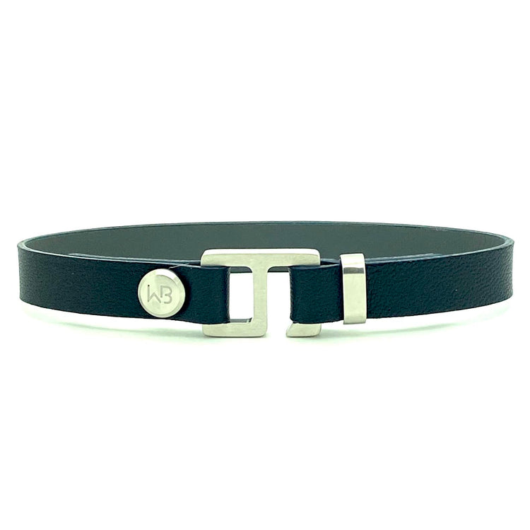 With a trendy, cool modern vibe, this navy blue/ charcoal grey leather cuff bracelet is paired with your choice of brushed stainless steel, brass or black ceramic hardware. Our signature cuff bracelet is a modern staple for your WristBend collection. Made by WristBend
