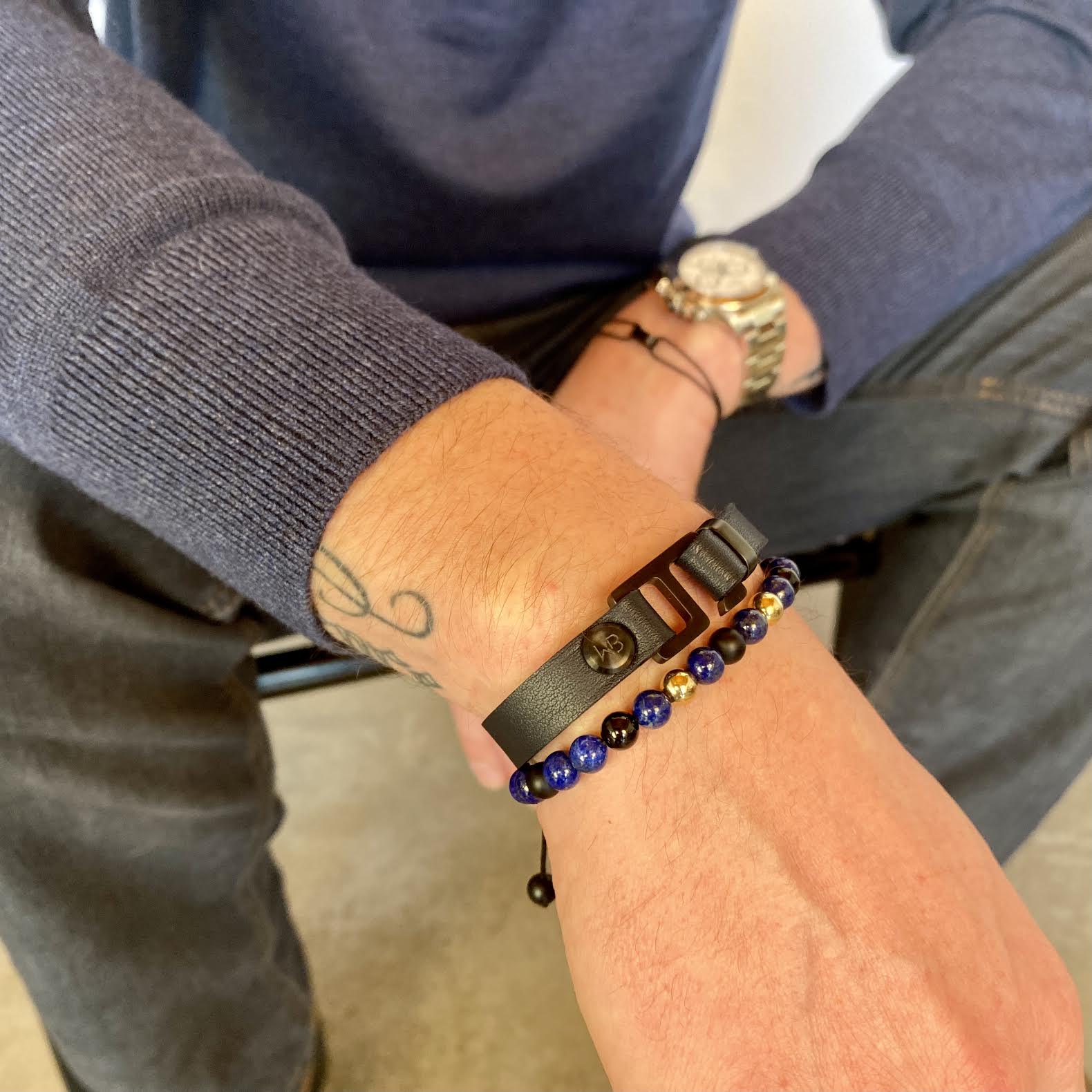 With a trendy, cool modern vibe, this navy/sky blue French leather cuff bracelet is paired with your choice of brushed stainless steel, brass or black ceramic hardware. Our signature cuff bracelet is a modern staple for your WristBend collection. Made by WristBend