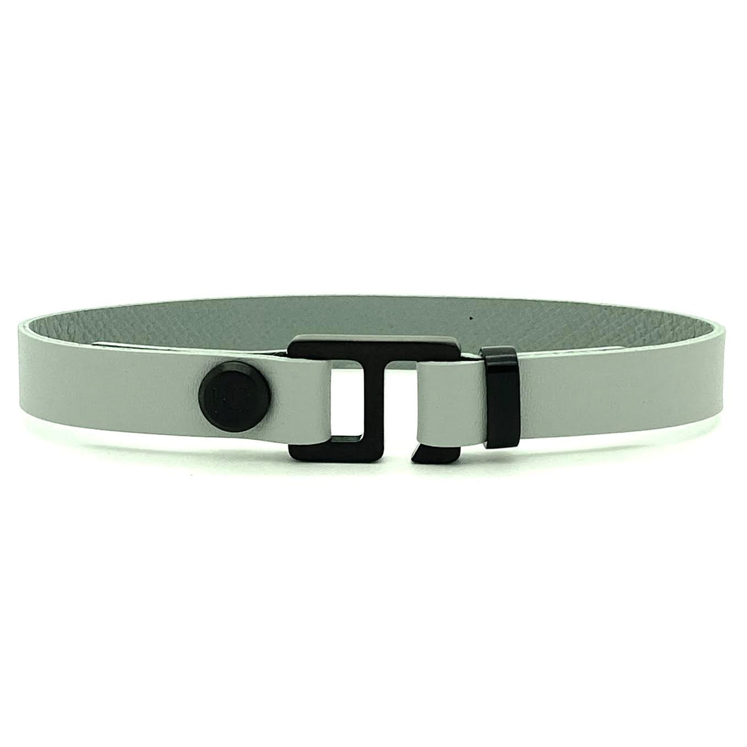 With a trendy, cool modern vibe, this French charcoal/smoke grey leather cuff bracelet is paired with your choice of brushed stainless steel, brass or black ceramic hardware. Our signature cuff bracelet is a modern staple for your WristBend collection. Made by WristBend