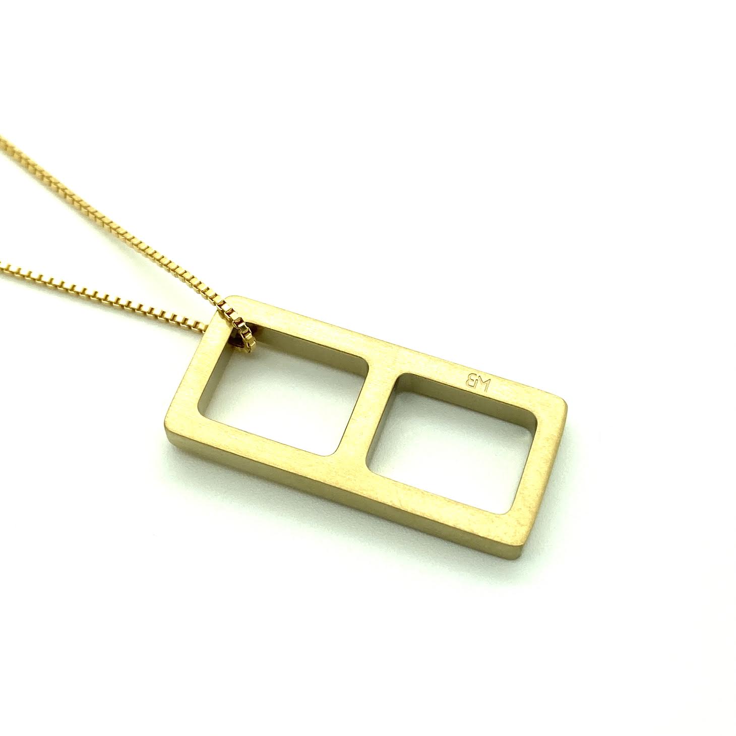 This meticulously designed with a geometrical flavor, this brushed yellow gold pendant necklace is perfect worn alone or paired with a WristBend stacking bracelet. Made by WristBend