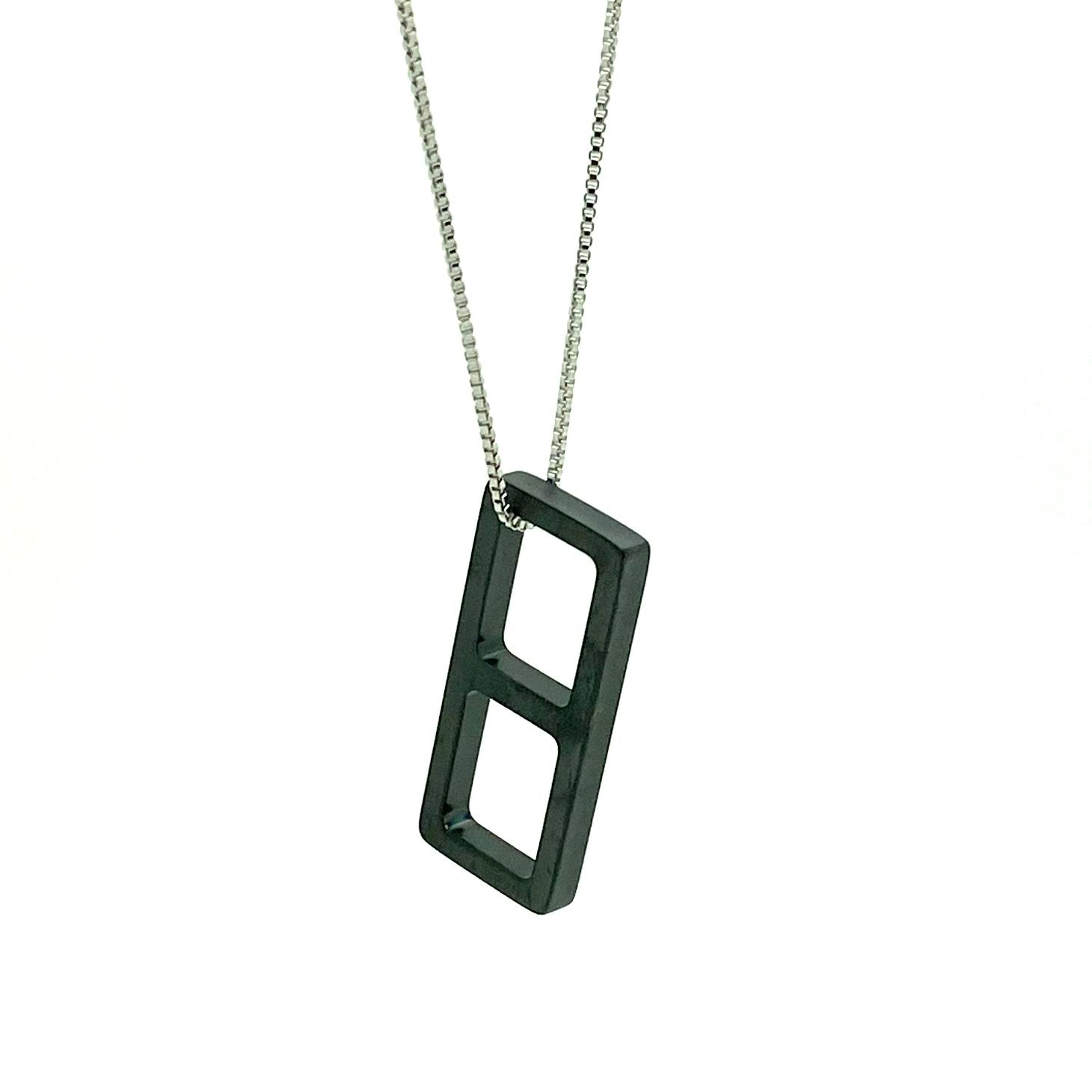 This meticulously designed with a geometrical flavor, this brushed black ceramic pendant necklace is perfect worn alone or paired with a WristBend stacking bracelet. Made by WristBend