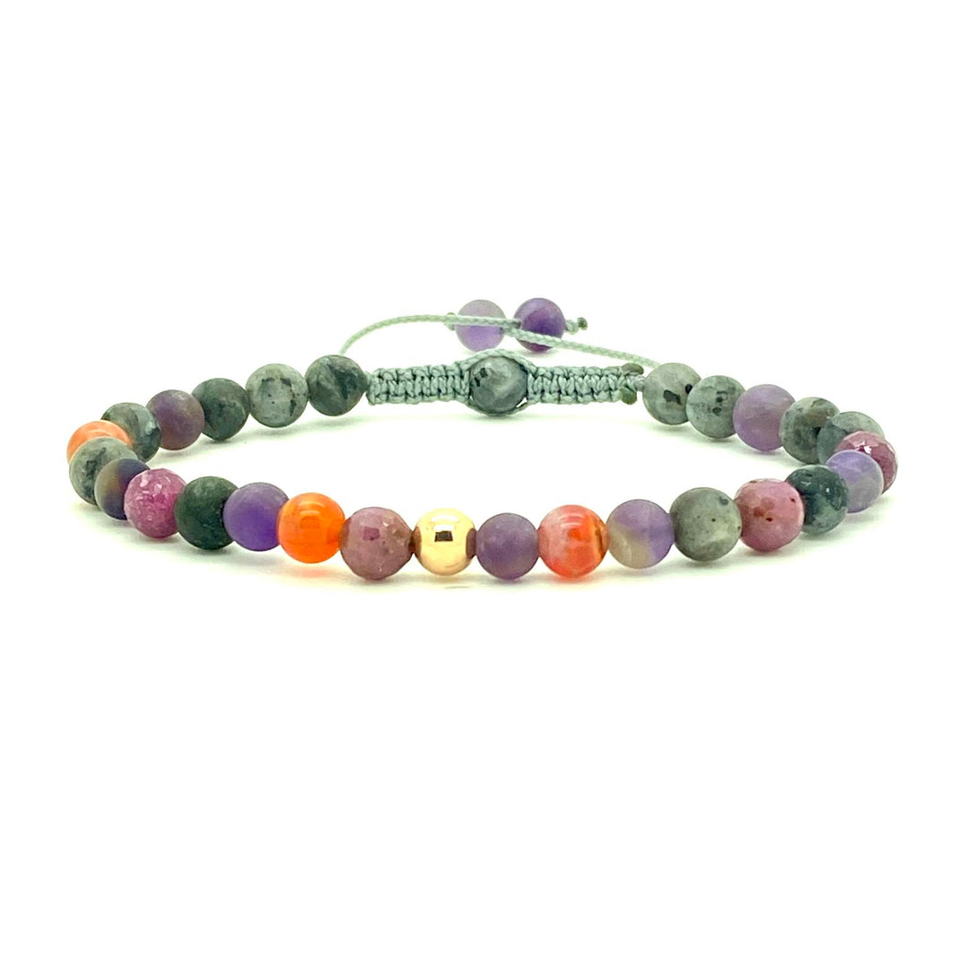 Labradorite is a stunning semi-precious stone that has the power to heal, protect, and produce positive energy. Accented with assorted gemstone beads and your choice of a 14K solid white, rose or yellow gold bead. Hand knotted adjustable cord for a perfect fit. Made by WritBend