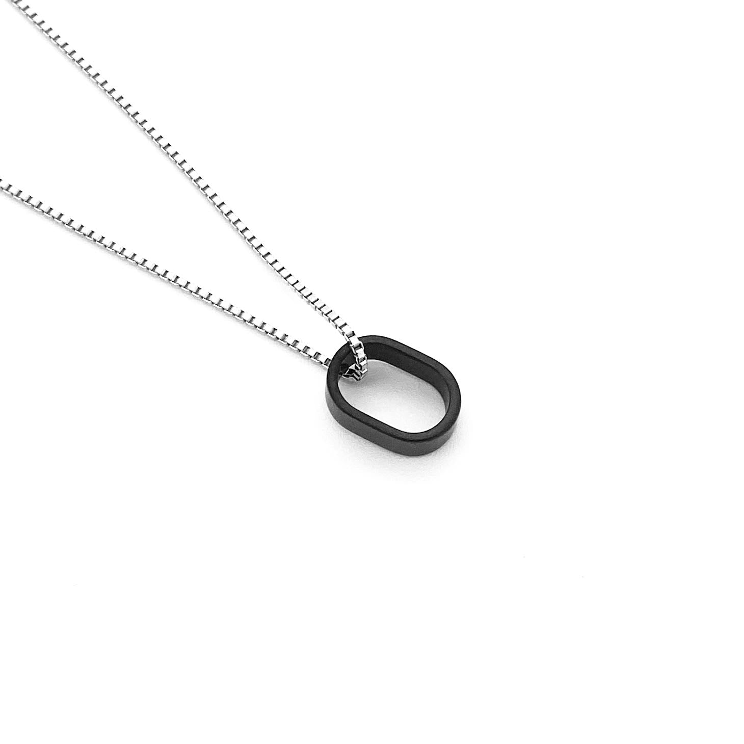 This meticulously designed, with a geometrical flavor, brushed black ceramic pendant necklace is perfect worn alone or paired with a WristBend stacking bracelet. Made by WristBend