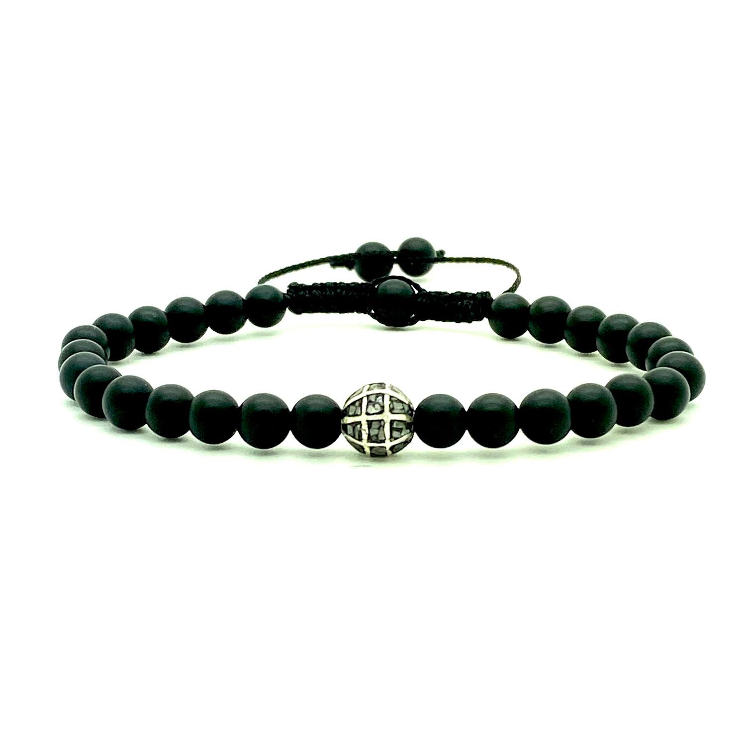 This popular matte onyx beaded bracelet is accented with a single black diamond chip bead for a cool, confident look. Hand knotted adjustable cord for a perfect fit. Made by WristBend