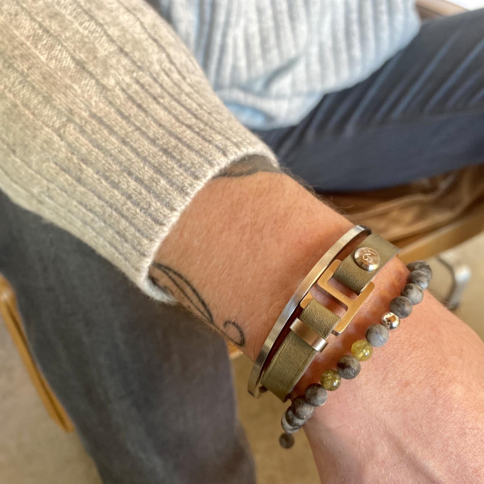 With a trendy, cool modern vibe, this sapin/patina gray Italian leather cuff bracelet is paired with your choice of brushed stainless steel, brass or black ceramic hardware. Our signature cuff bracelet is a modern staple for your WristBend collection. Made by WristBend