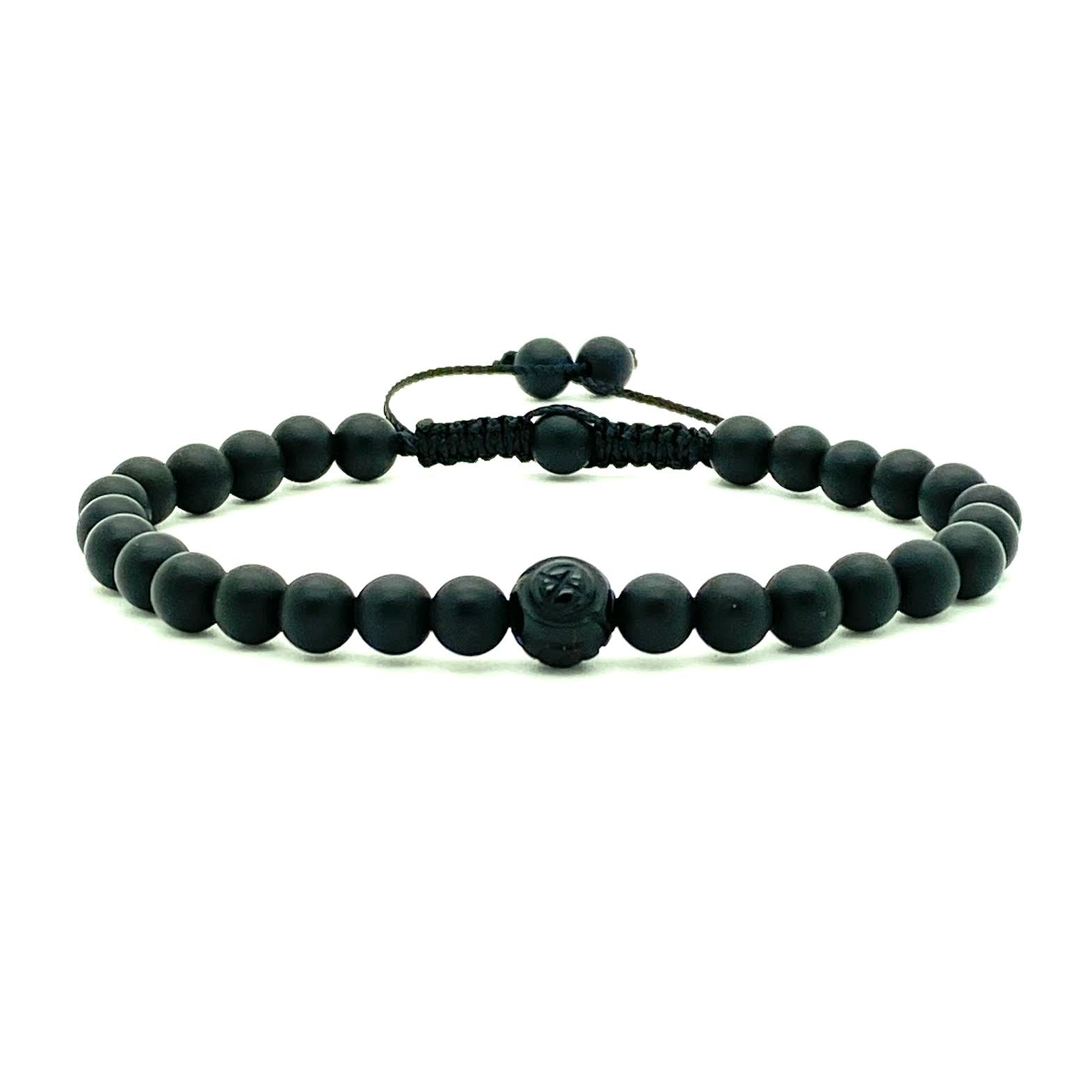 This popular matte onyx beaded bracelet is accented with a single carved black onyx dragon bead for a cool, confident look. Hand knotted adjustable cord for a perfect fit. Made by WristBend