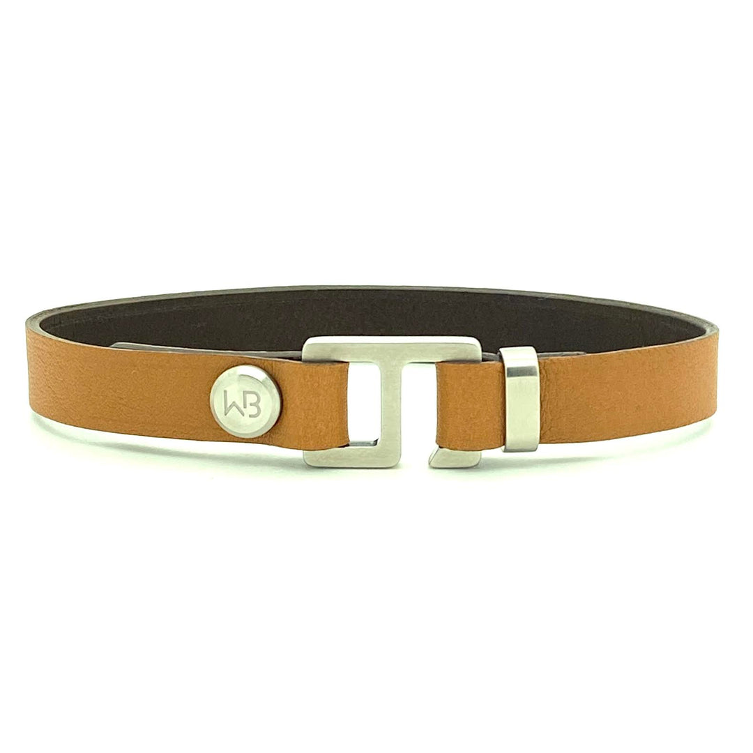 With a trendy, cool modern vibe, this tan/dark brown Italian leather cuff bracelet is paired with your choice of brushed stainless steel, brass or black ceramic hardware. Our signature cuff bracelet is a modern staple for your WristBend collection. Made by WristBend