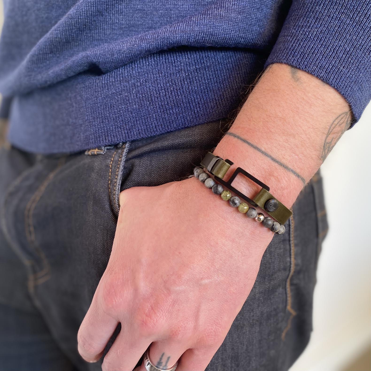 Our striking RMG military green Italian leather bracelet is paired perfectly with our artisan designed, lightly brushed hardware. Your hardware choices include Rose Gold, Yellow Gold, Stainless Steel or Black Ceramic. This adjustable size bracelet is a distinctive piece worn alone or with a WristBend stacking bracelet. Made by WristBend
