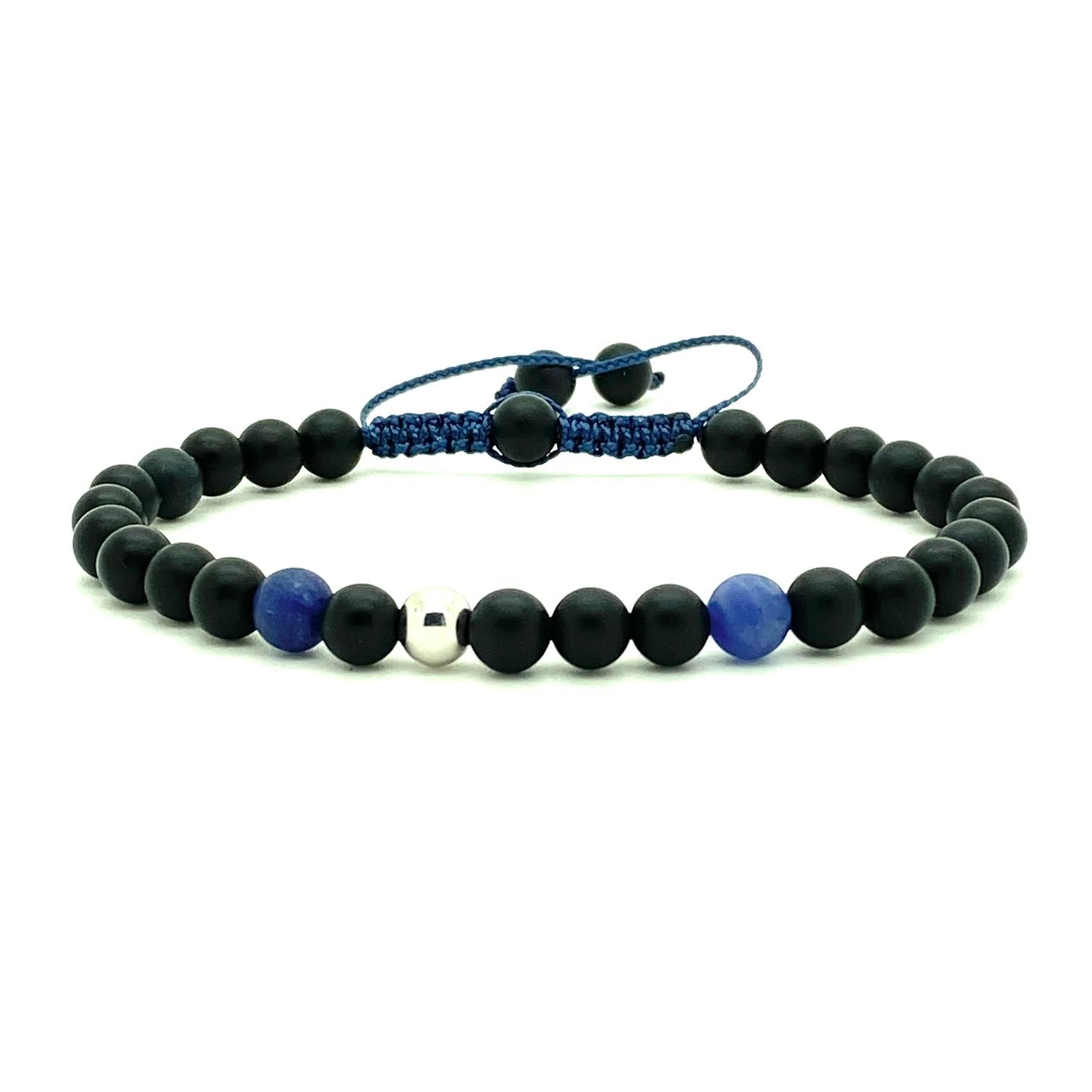 Trendy black matte onyx beads accented with two Sodalite beads, and your choice of a 14K solid white, rose or yellow gold bead. Hand knotted adjustable cord for a perfect fit. Made by WristBend