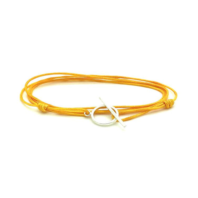 Trendy handknotted adjustable cord bracelet with sterling silver claps. WristBend
