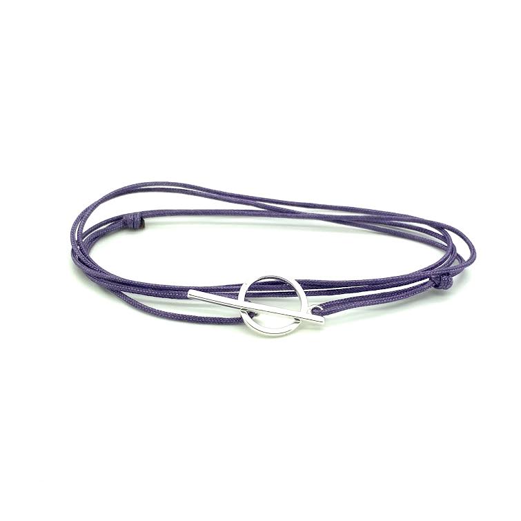 Popular handknotted adjustable cord bracelet with sterling silver clasp. WristBend