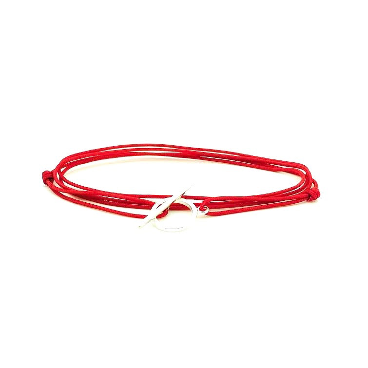 Popular red hanf knotted adjustable cord bracelet with sterling silver hardware. WristBend