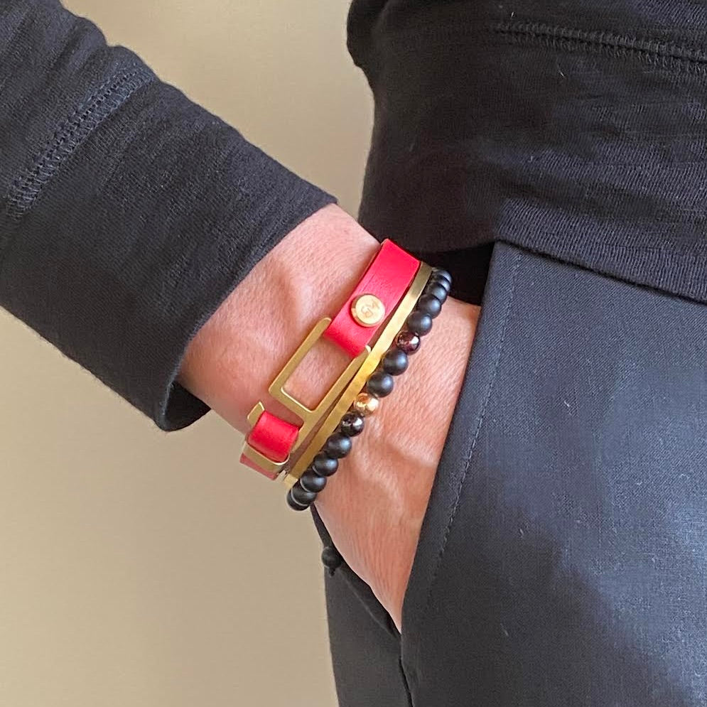 Our striking red Italian leather bracelet is paired perfectly with our artisan designed, lightly brushed hardware. Your hardware choices include Rose Gold, Yellow Gold, Stainless Steel or Black Ceramic. This adjustable size bracelet is a distinctive piece worn alone or with a WristBend stacking bracelet. Made by WristBend