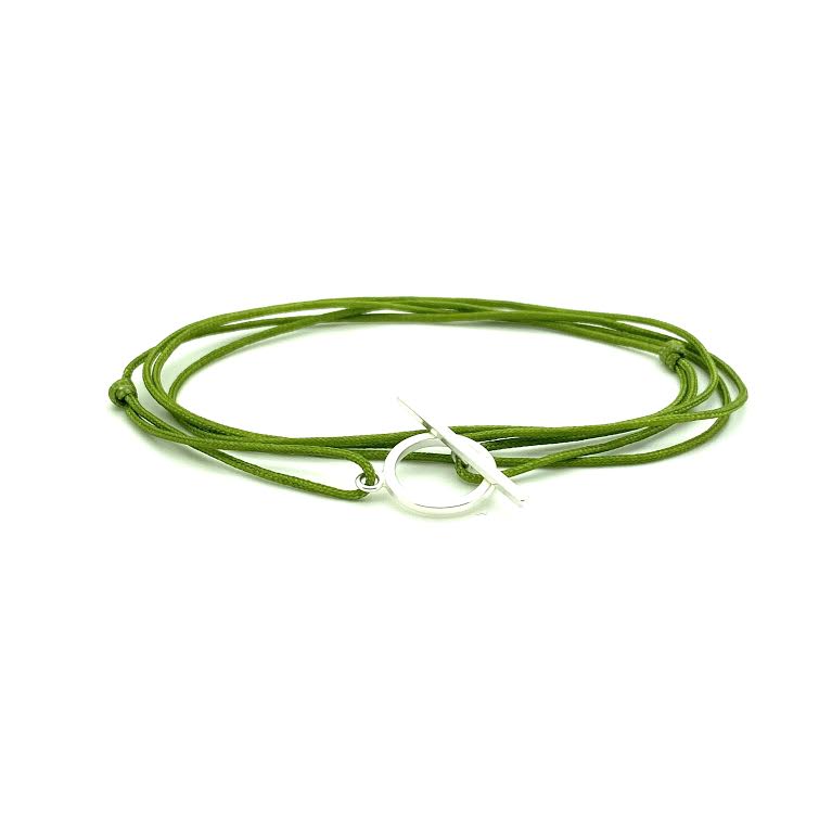 Hand handknotted adjustable cord bracelet with a sterling silver clasp. WristBend