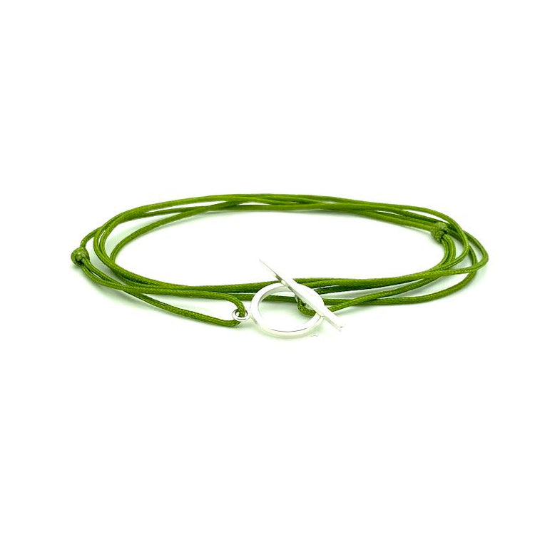 Hand handknotted adjustable cord bracelet with a sterling silver clasp. WristBend